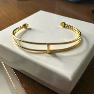 Trifari gold tone monogram L cuff bracelet